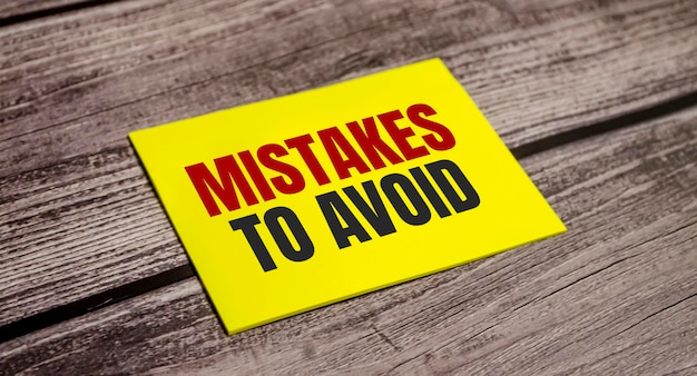 Photo mistakes to avoid text on the yellow sticker and wooden background