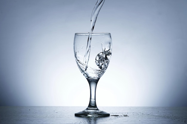 Photo of pouring water into SOUR GLASS