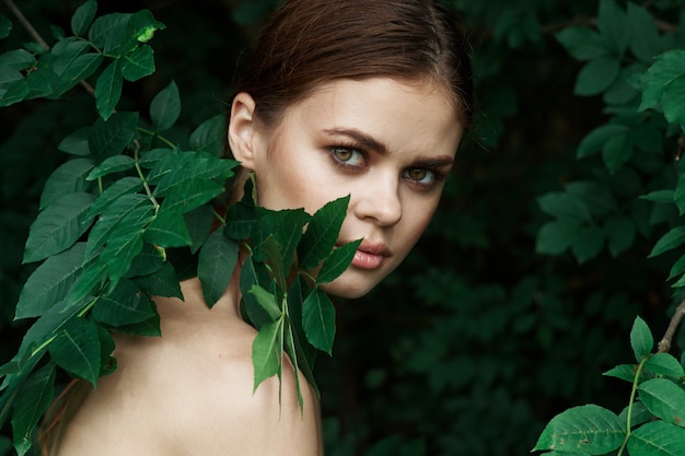 Photo portrait of a woman cosmetology nature green leaves glamor lifestyle