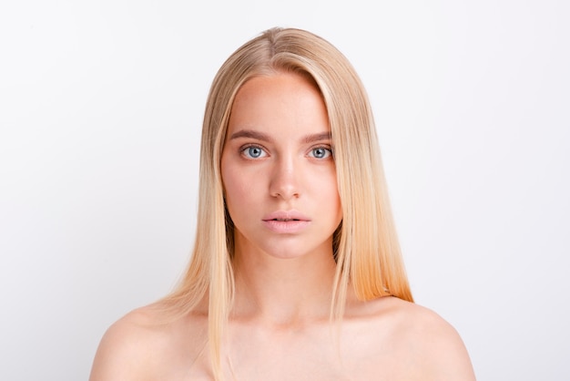 Portrait of young blonde woman with clear skin