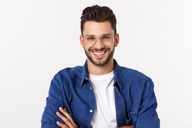 Photo portrait of the young happy smiling handsome man isolated on a white