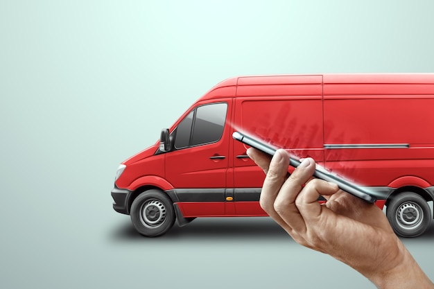 Photo smartphone and red minibus on a light background. delivery concept, online ordering, phone application, moving. delivery by car to anywhere.