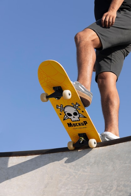Young man with mock-up skateboard