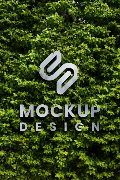 PSD conception de maquette de logo mural avec fond de végétation