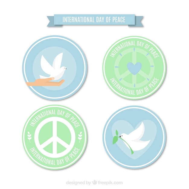 Vector gratuito insignias circulares con símbolos de la paz