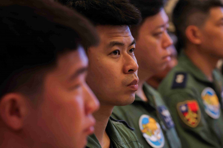 Air Force pilots listen while Taiwan's President Lai Ching-te (not pictured) speaks at a military base in Hualien, Taiwan May 28, 2024. 