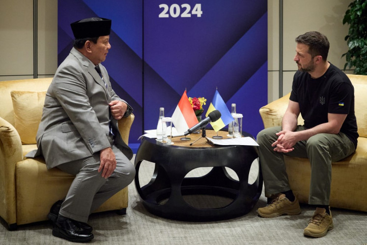 In this handout photograph taken and released by the Ukrainian Presidential Press Service on June 1, 2024, Ukraine's President Volodymyr Zelensky (right) attends a meeting with Indonesia's Defense Minister and president-elect Prabowo Subianto (left) during Shangri-La Dialogue Summit in Singapore. Ukrainian President Volodymyr Zelensky arrived at a Singapore security forum on June 1 as he seeks to rally support for Kyiv while a Russian offensive gains ground.  