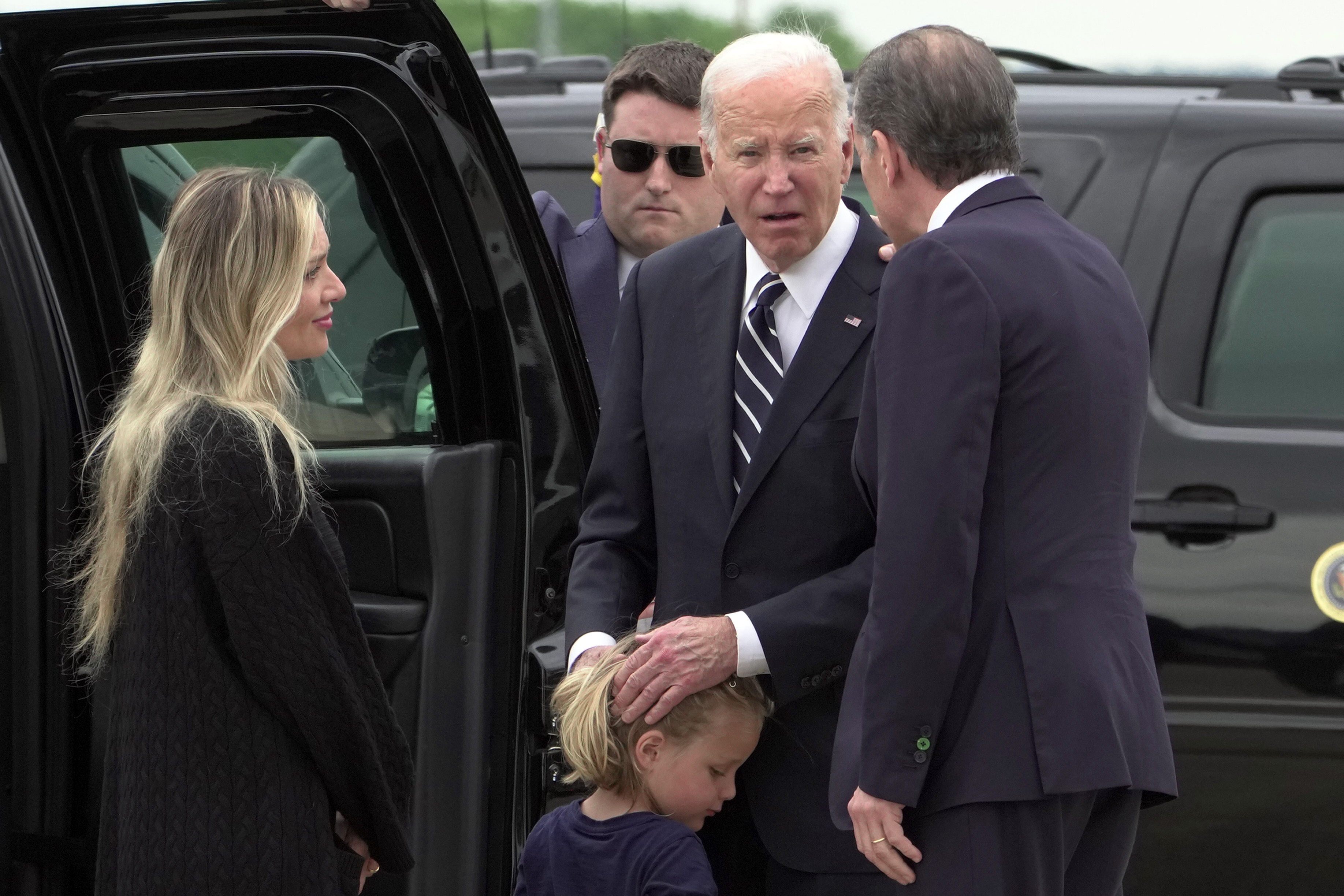 President Joe Biden talks with his son Hunter Biden and wife Melissa Cohen Biden, and grandson Beau, as he arrives Delaware Air National Guard Base in New Castle, Del., Tuesday, June 11, 2024. (AP Photo/Manuel Balce Ceneta)