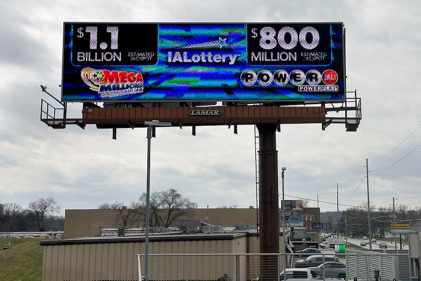 An electronic billboard advertises the Mega Millions and Powerball jackpots in Iowa. 