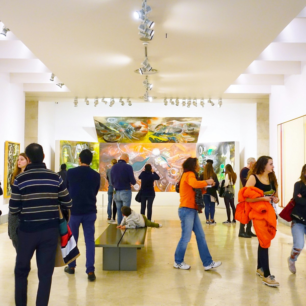 Visitors look at the pictures in the museum Thyssen-Bornemisza.