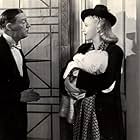 Ginger Rogers, E.E. Clive, and Elbert Coplen Jr. in Bachelor Mother (1939)