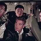 George Clooney, Don Cheadle, Casey Affleck, and Shaobo Qin in Ocean's Eleven (2001)