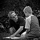 Between scenes, director David Anspaugh confers with Chandler Canterbury, regarding the young actor's lead role as Zach Bonner.