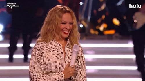Pop icon Kylie Minogue takes center stage in her very own musical extravaganza. Joining her are some fellow pop stars, each performing in front of a celebrity audience.