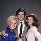 Pierce Brosnan, Stephanie Zimbalist, and Doris Roberts in Remington Steele (1982)