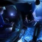 Conceptual footage:  An imaginary futuristic mission to an as yet undiscovered world encounters alien life.  In crew sphere; Dijanna Figueroa (Marine Animal Physiologist - University of California at Santa Barbara, left), Kevin Peter Hand (Planetary Scientist, Sanford University/SETI Institute, right)