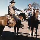 John Wayne and photographer David Sutton on the set of "Chisum"