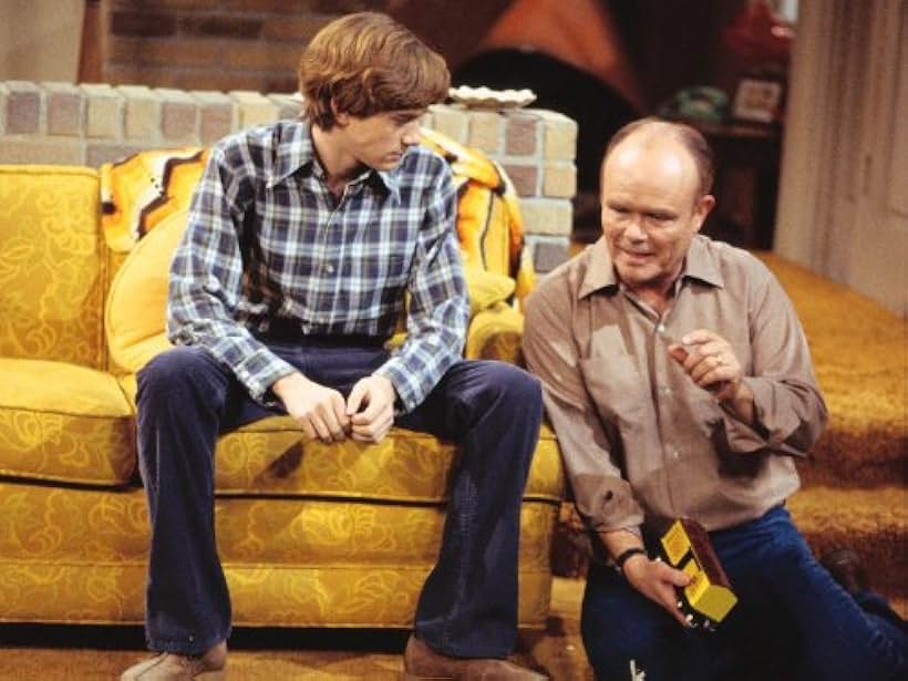 Kurtwood Smith and Topher Grace in That '70s Show (1998)