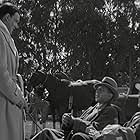 Douglas Fowley, Lloyd Nolan, and Walter Pidgeon in Big Brown Eyes (1936)