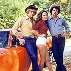 Catherine Bach, John Schneider, and Tom Wopat in The Dukes of Hazzard (1979)
