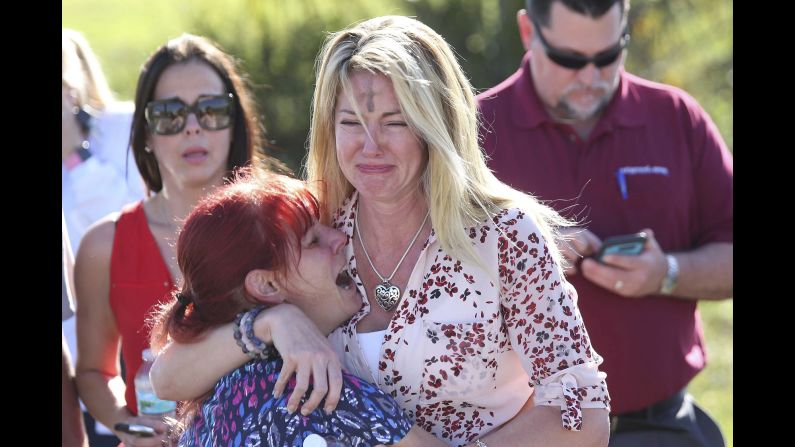 Parents wait for news after a shooting at Marjory Stoneman Douglas High School in Parkland, Florida, on Wednesday, February 14.<a href="https://www.cnn.com/2018/02/14/us/florida-high-school-shooting/index.html" target="_blank"