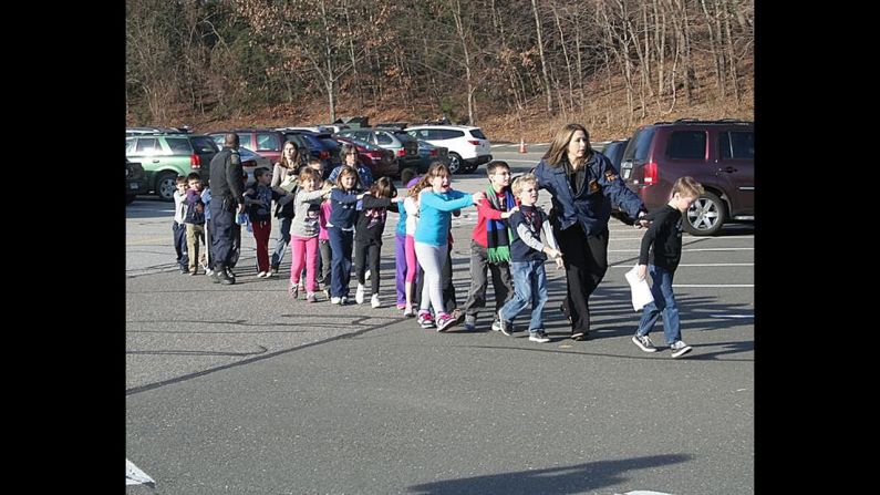 Connecticut State Police evacuate <a href="http://www.cnn.com/2012/12/14/us/connecticut-school-shooting/index.html" target="_blank"