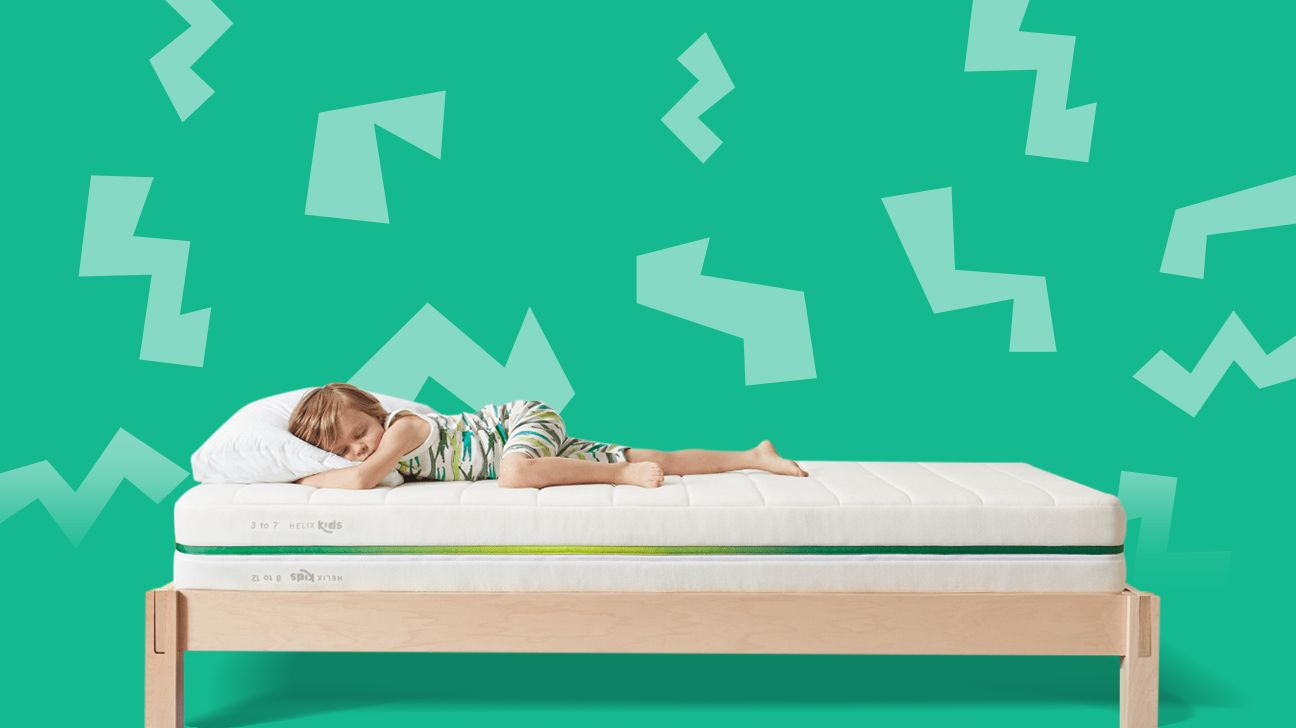 child lying on a twin bed