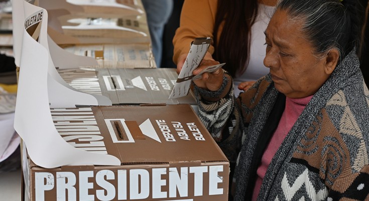 Mexican woman casting her vote at the Tijuana Cultural Center during Mexico's general election in Tijuana, Baja California, Mexico