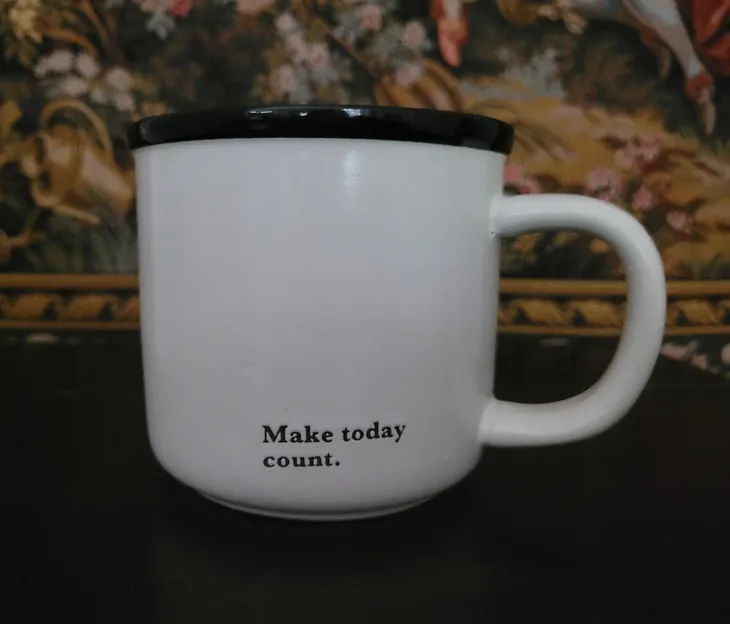 Picture of a mug that says, “Make today count.”
