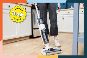 A person vacuuming a floor using the Bissell TurboClean Cordless Hard Floor Cleaner