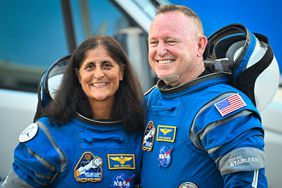 NASA astronauts Butch Wilmore (R) and Suni Williams, wearing Boeing spacesuits, depart the Neil A. Armstrong Operations and Checkout Building at Kennedy Space Center for Launch Complex 41 at Cape Canaveral Space Force Station in Florida to board the Boeing CST-100 Starliner spacecraft 