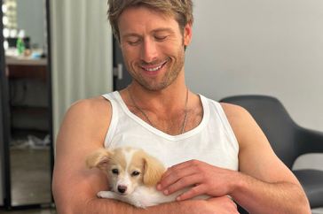 Glen Powell adopts a puppy