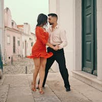 Sensual dancers performing latin american style on city street. Couple dancing 
