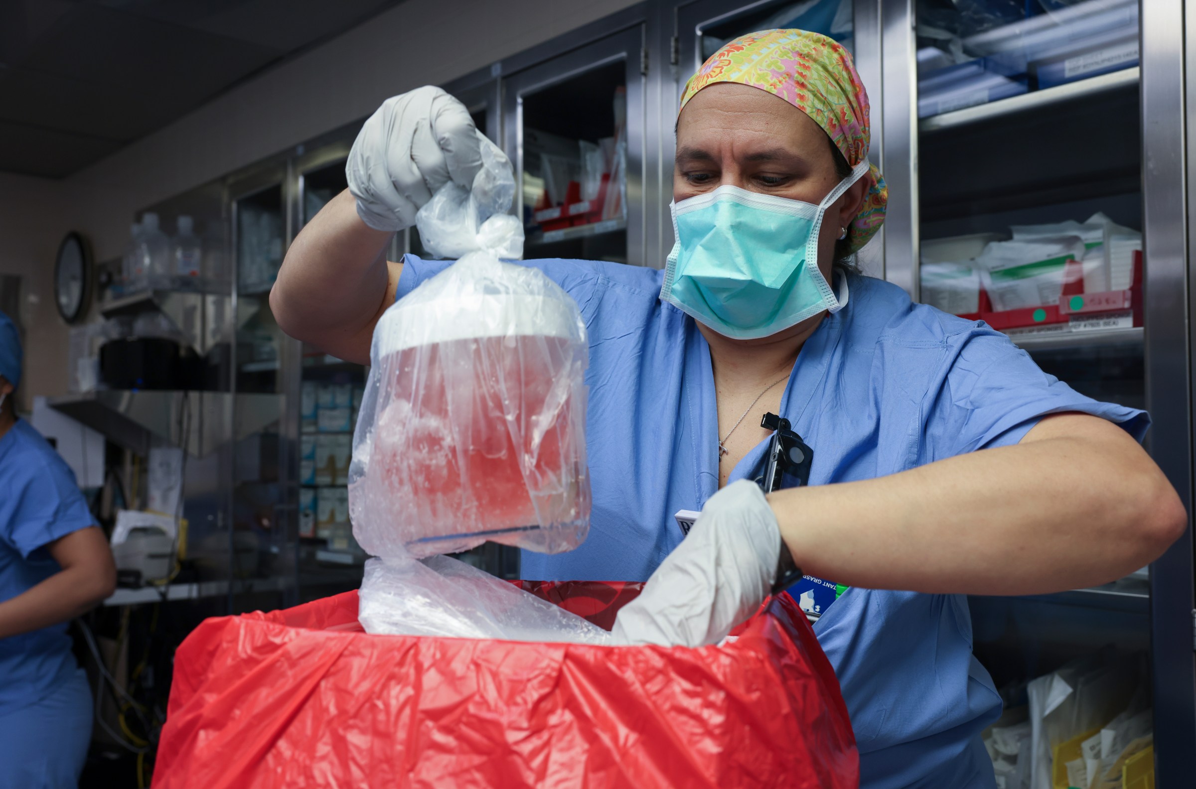 Melissa Mattola-Kiatos, RN, removes the pig kidney from its box to prepare for transplantation as part of Mass General’s historic pig kidney transplant surgery on March 16, 2024.