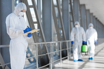 Virologists in protective hazmat suits controlling epidemic