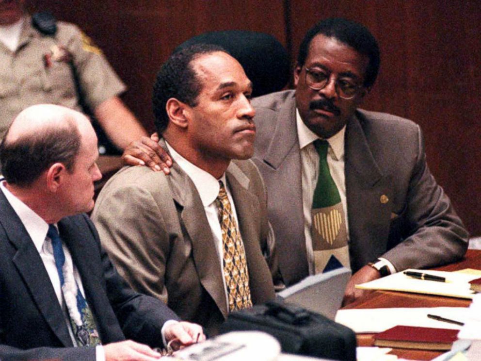 PHOTO: Johnnie Cochran puts his arm on O.J. Simpson's shoulder after Simpson told Judge Lance Ito that he has faith that jurors will acquit him of the murder of his ex-wife Nicole Simpson and her friend, Ronald Goldman, Sept. 22, 1995, in Los Angeles.  