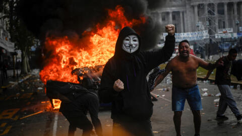 A demonstrator gestures during a protest near the National Congress in Buenos Aires, Argentina, June 12, 2024.
