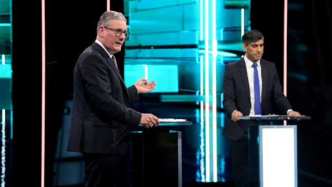 Britain's Labour Party leader Keir Starmer debates with Conservative Party leader and Prime Minister Rishi Sunak, in the first head-to-head debate of the general election, in Salford, June 4, 2024.