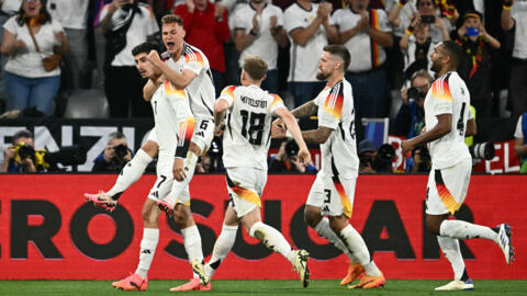 Germany's forward #07 Kai Havertz celebrates with Germany's defender #06 Joshua Kimmich after scoring his team's third goal during the UEFA Euro 2024 Group A football match.