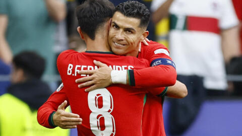 Portugal's Bruno Fernandes celebrates scoring their third goal with Cristiano Ronaldo in Dortmund, Germany, on June 22, 2024.