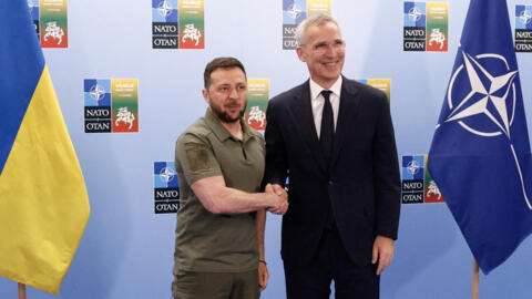 NATO Secretary General Jens Stoltenberg (R) shakes hands with Ukrainian President Volodymyr Zelensky ahead of a joint press conference at the NATO summit in Vilnius, Lithuania on July 12, 2023.