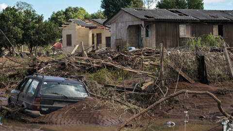 Destroyed houses, damaged cars, branches, and debris are seen in Cruzeiro do Sul following the devastating floods that hit the region in Rio Grande do Sul state, Brazil, on May 14, 2024. 