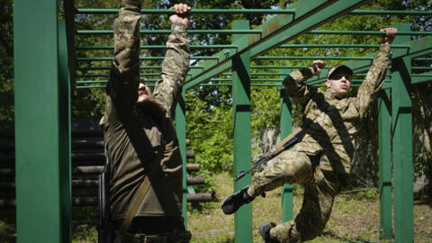 Newly recruited soldiers of the 3rd assault brigade train in Kyiv, Ukraine, Friday, May 17, 2024.
