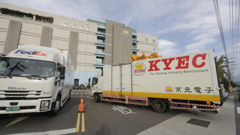 Trucks move in and out of the factory of King Yuan Electronics Co. in Miaoli County, western Taiwan, May 9, 2024. In late April 2024, King Yuan Electronics Corp., a Taiwanese company specializing in s