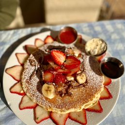 Immigrant Son Caffe - Pancakes with strawberries bananas and Nutella.