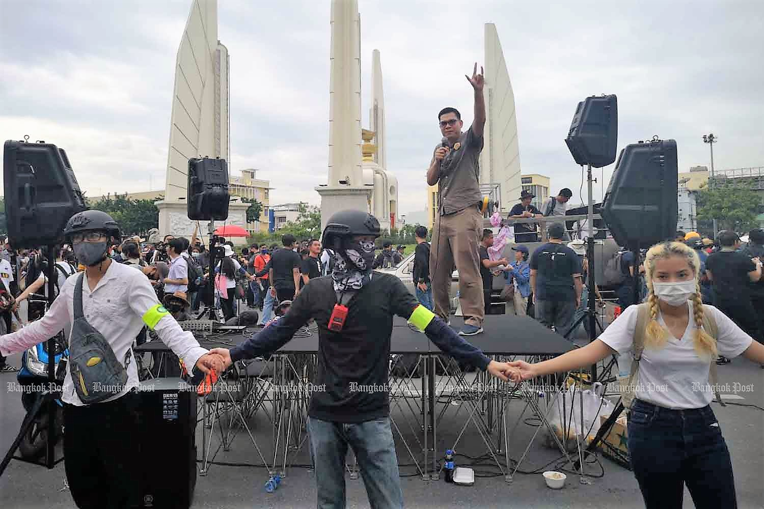 Protesters gather at Democracy Monument
