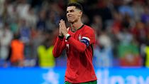 Portugal's Cristiano Ronaldo reacts after scoring in penalties shootouts during a round of sixteen match between Portugal and Slovenia at Euro 2024